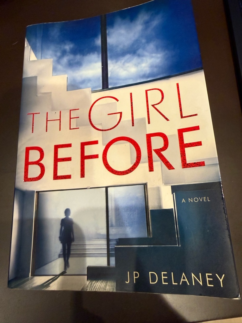 The Girl Before by JP Delaney - Blue & White Hardcover Novel